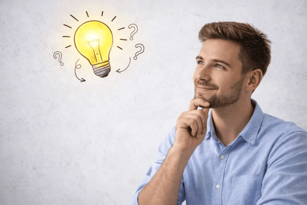 A graphic of a glowing lightbulb next to a question mark, representing common beginner freelancing questions and their answers